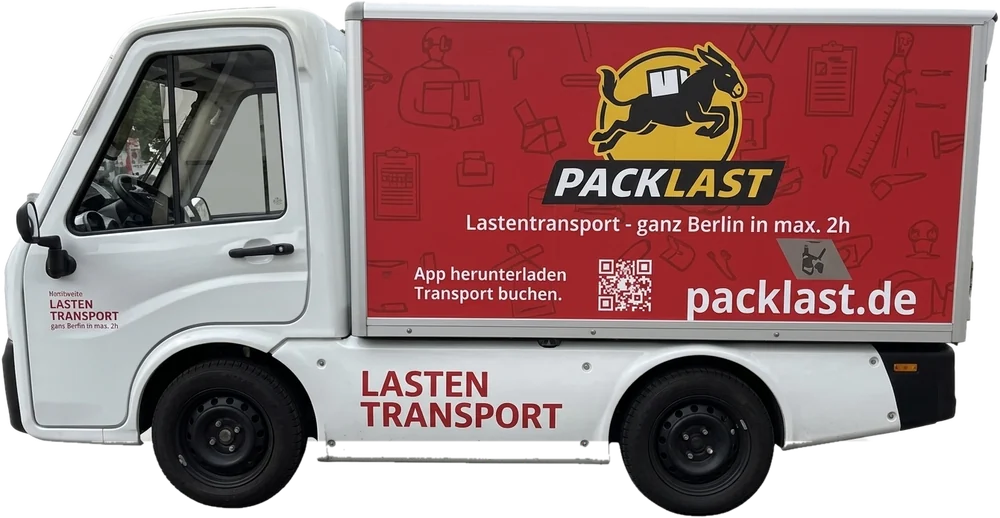 Packlast Elektro-Lastentransporter in Berlin: weißes Fahrzeug mit rotem Kofferaufbau, Packlast-Logo und packlast.de